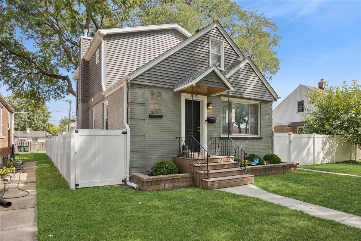 a front view of house with a garden