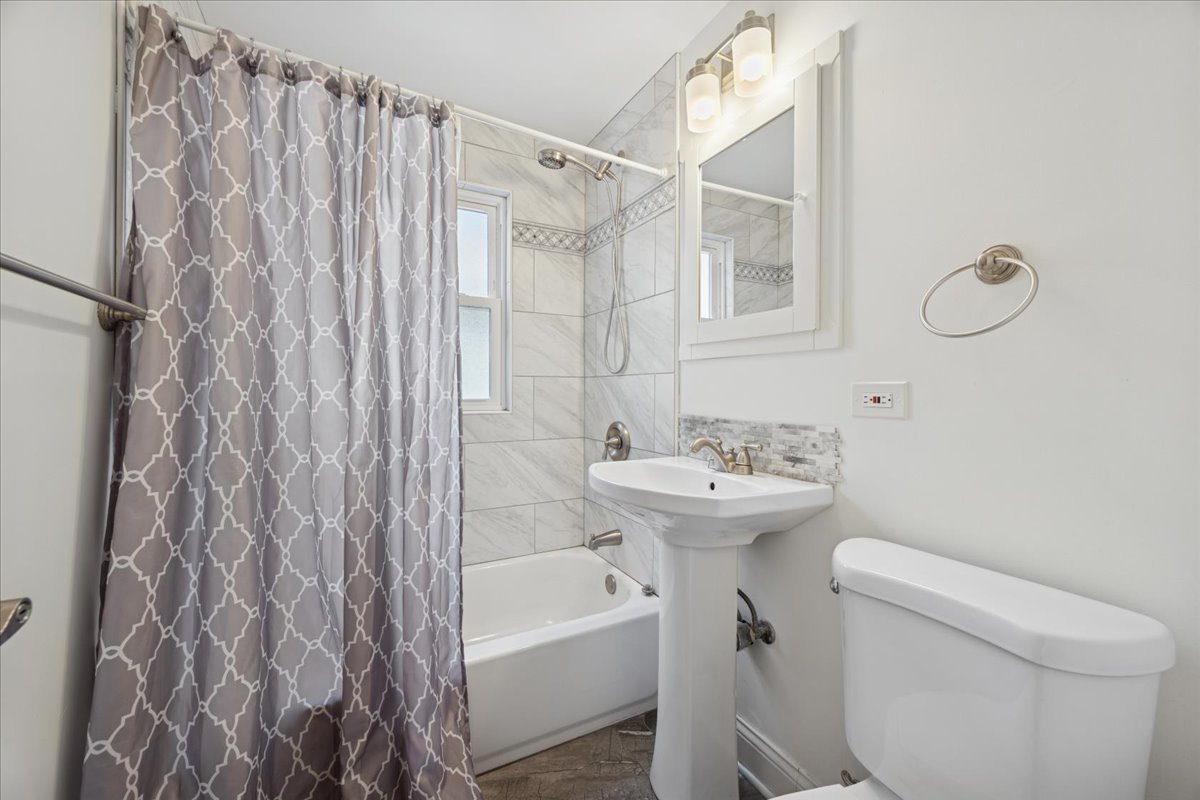 3931 Maple Avenue Brookfield, IL 60513 - Photo 11 of 24 a bathroom with a sink toilet and shower