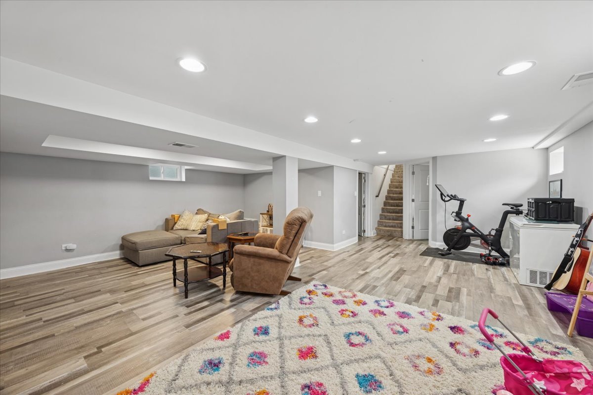 3931 Maple Avenue Brookfield, IL 60513 - Photo 19 of 24 a living room with furniture and a wooden floor