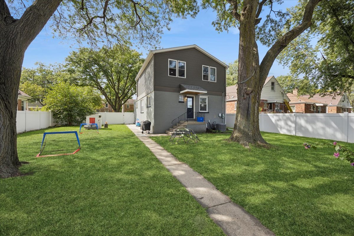 3931 Maple Avenue Brookfield, IL 60513 - Photo 22 of 24 a view of a yard in front of a house with a large tree
