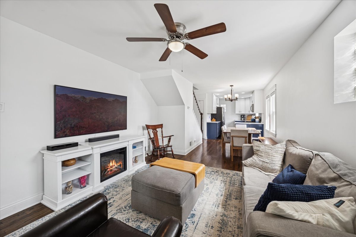 3931 Maple Avenue Brookfield, IL 60513 - Photo 3 of 24 a living room with furniture a flat screen tv and a fireplace