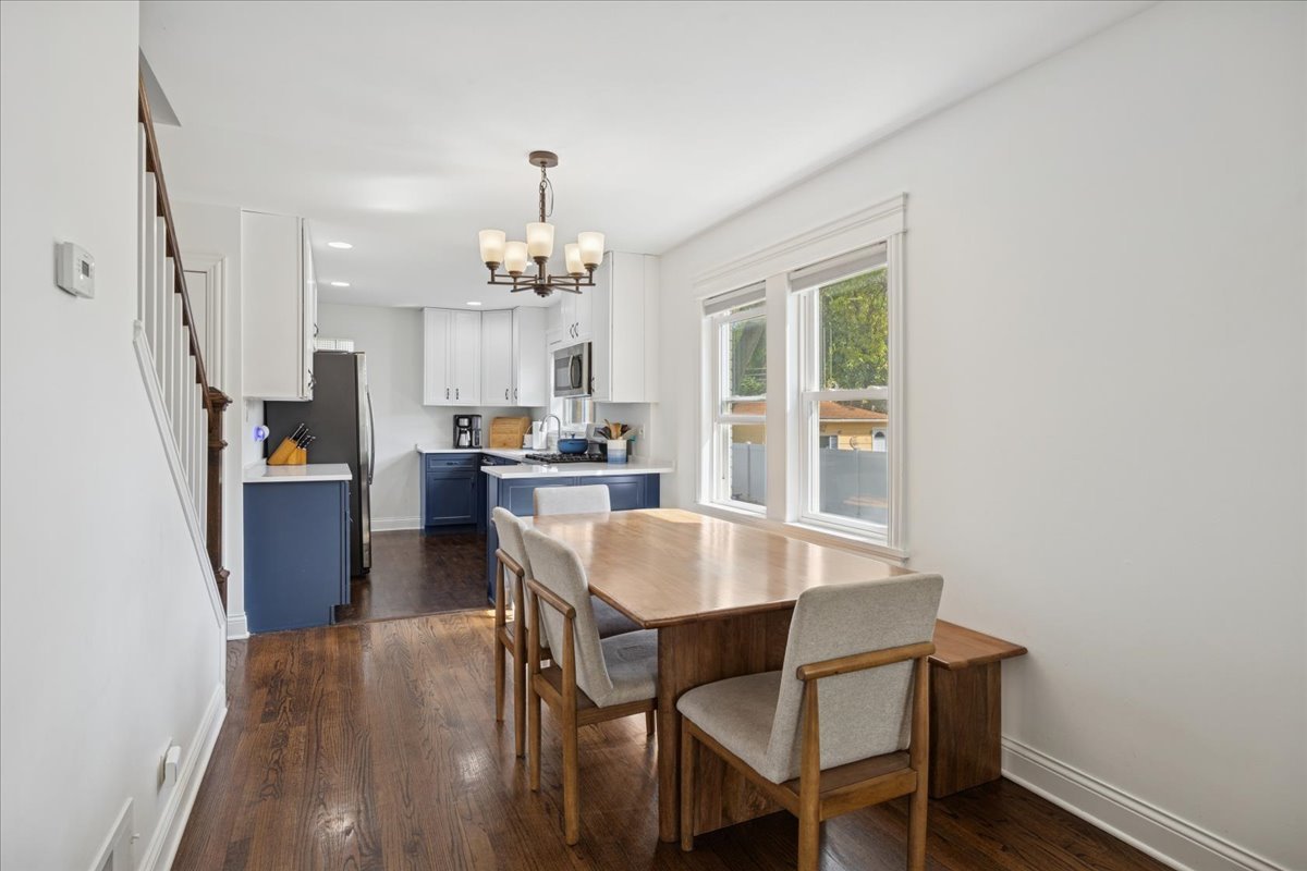 3931 Maple Avenue Brookfield, IL 60513 - Photo 6 of 24 a view of a dining room with furniture and wooden floor