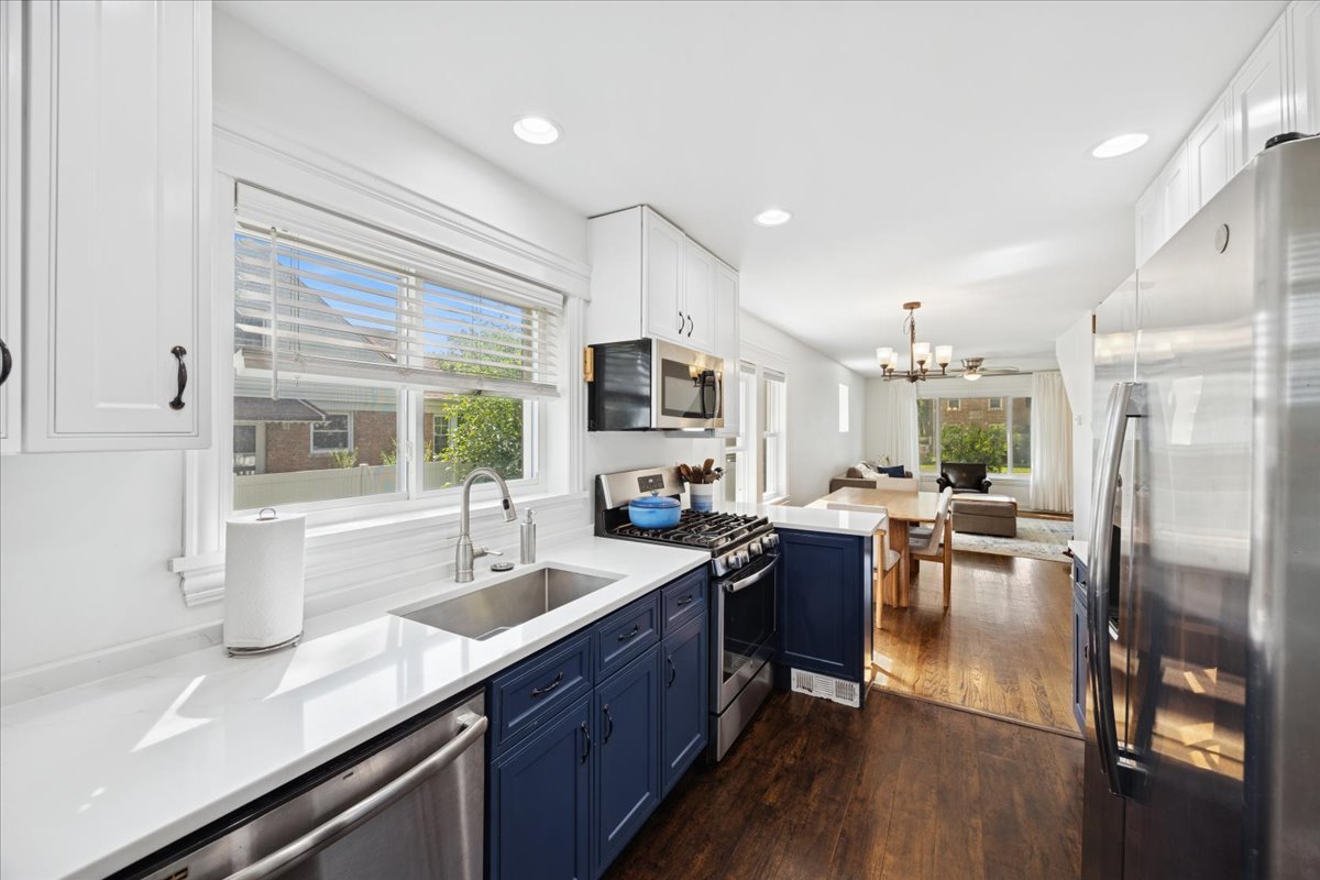 3931 Maple Avenue Brookfield, IL 60513 - Photo 8 of 24 a large kitchen with a table and chairs in it