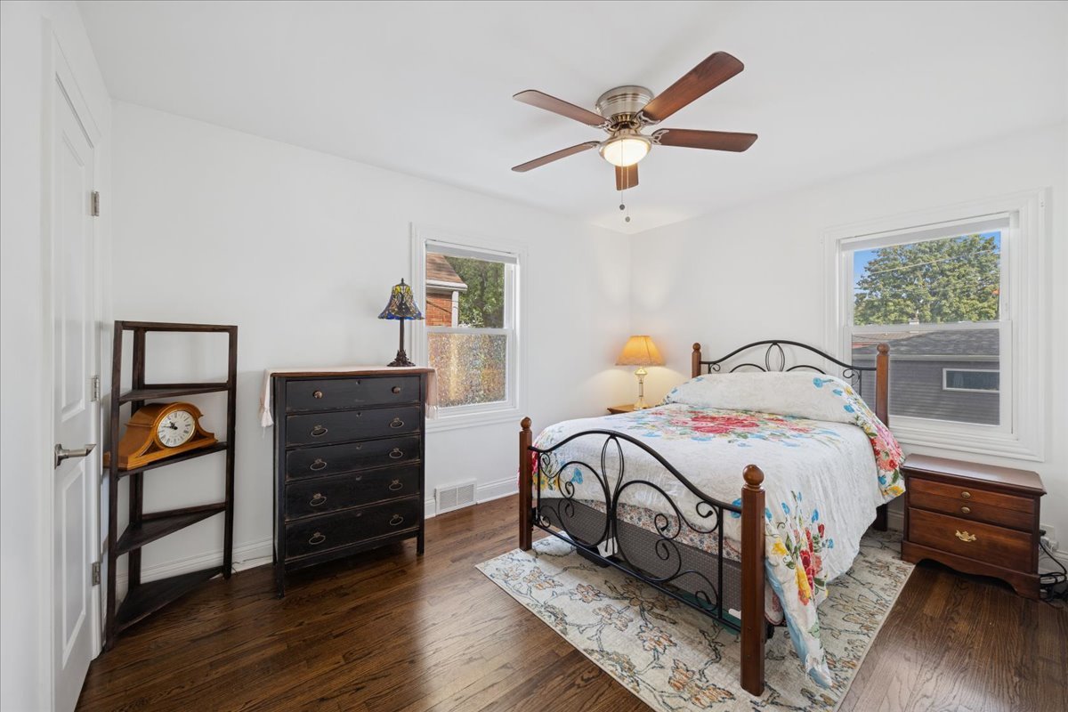 3931 Maple Avenue Brookfield, IL 60513 - Photo 9 of 24 a bedroom with a bed and a dresser