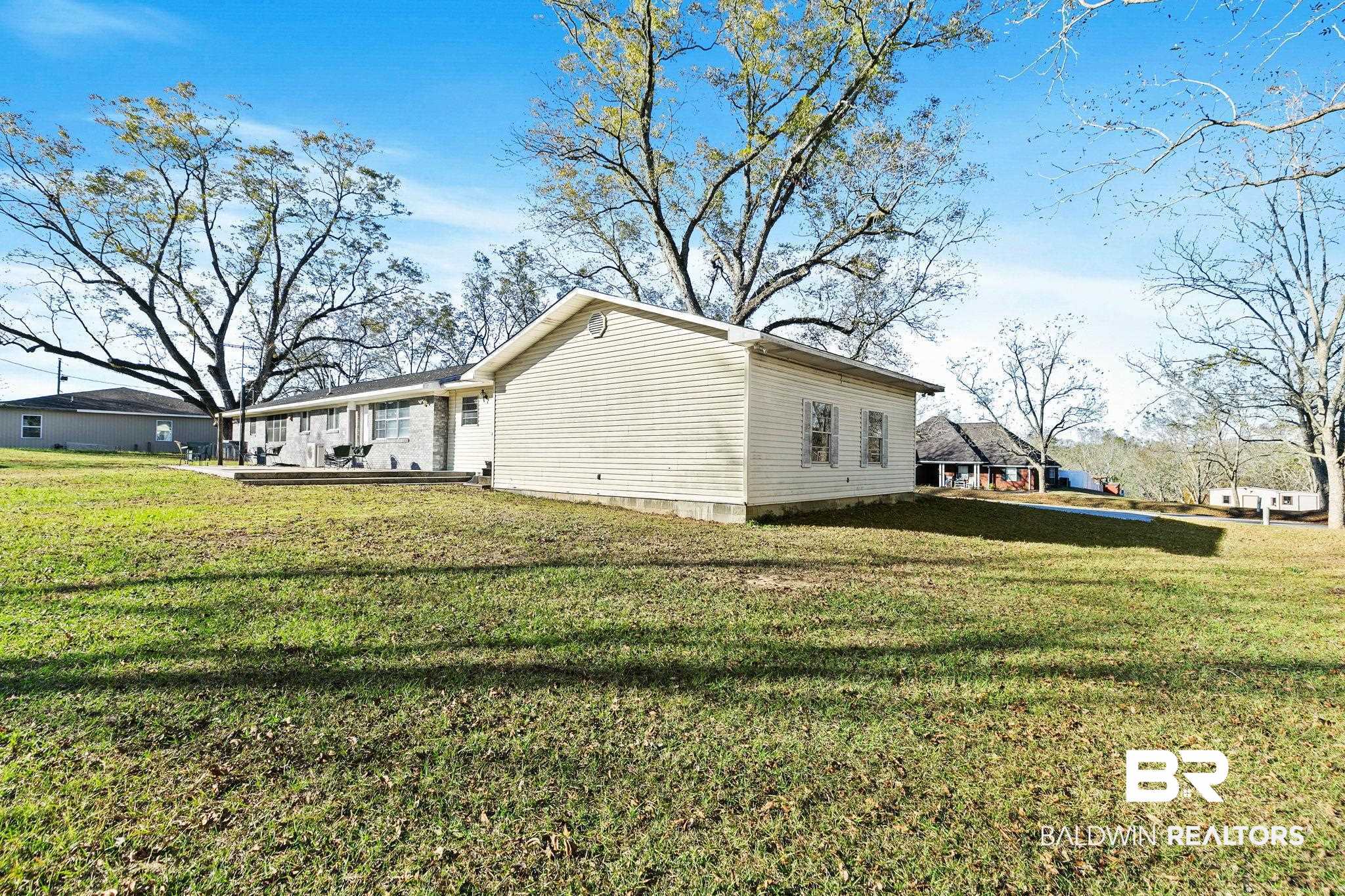 21267 Loop Road Andalusia, AL 36421 - Photo 53 of 72 View of side of home with a yard