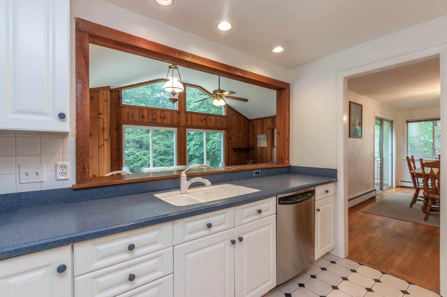 9 Sheffield Road Norwalk, CT 06853 - Photo 17 of 29 a kitchen with granite countertop a sink and white cabinets
