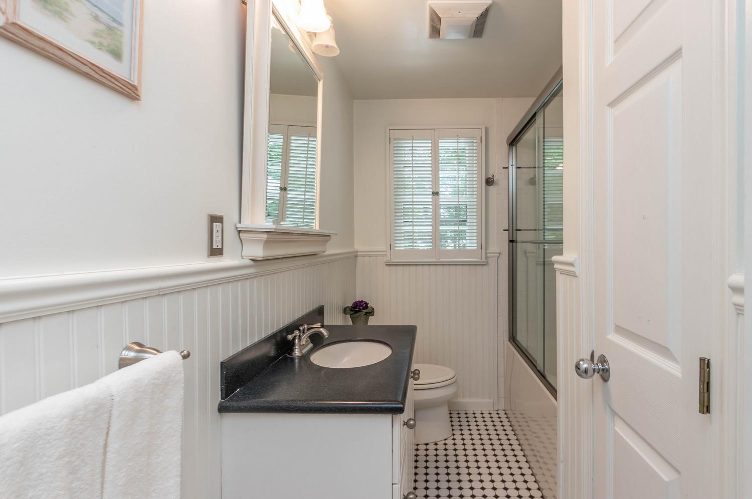 9 Sheffield Road Norwalk, CT 06853 - Photo 19 of 29 a bathroom with a sink and a tub