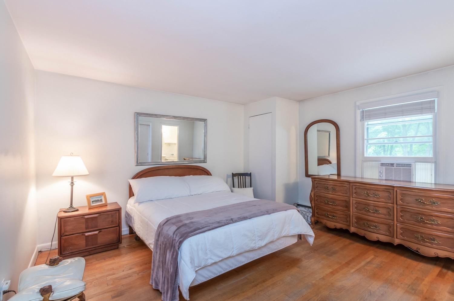 9 Sheffield Road Norwalk, CT 06853 - Photo 20 of 29 a bedroom with a bed and a window