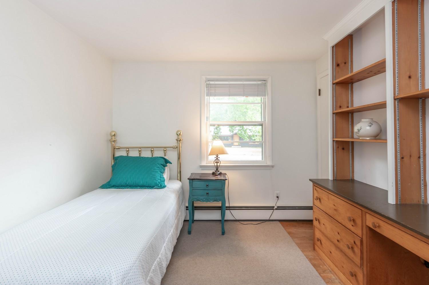 9 Sheffield Road Norwalk, CT 06853 - Photo 24 of 29 a bedroom with a bed and a window