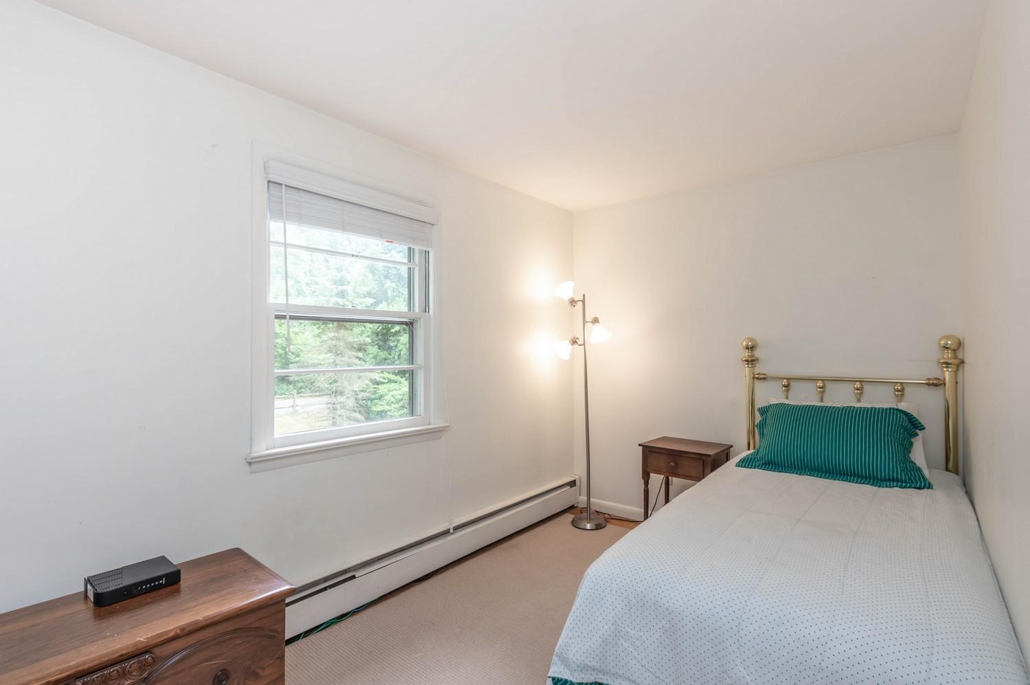 9 Sheffield Road Norwalk, CT 06853 - Photo 25 of 29 a bedroom with a bed and window