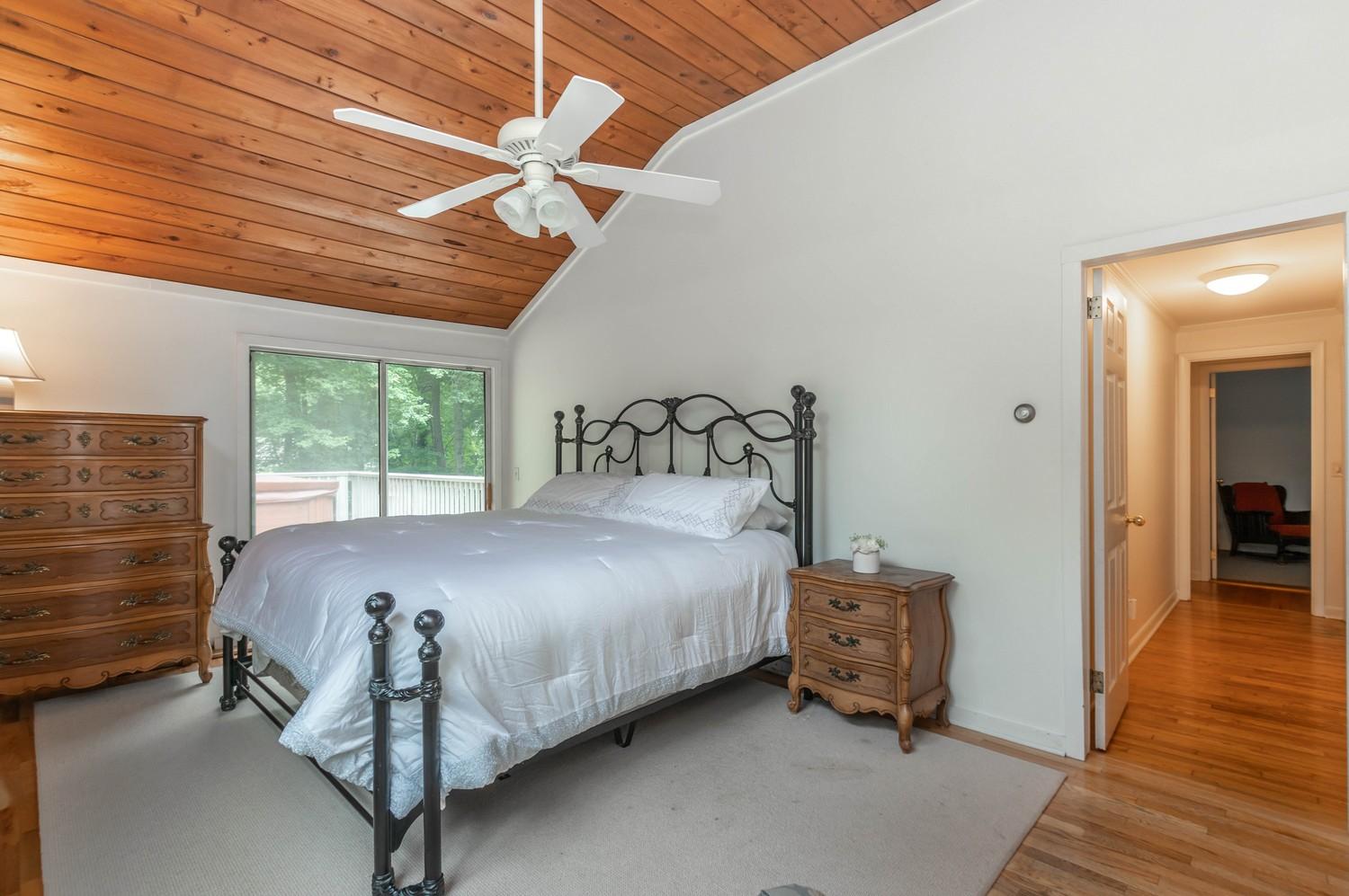 9 Sheffield Road Norwalk, CT 06853 - Photo 27 of 29 a large bed sitting in a room next to a window