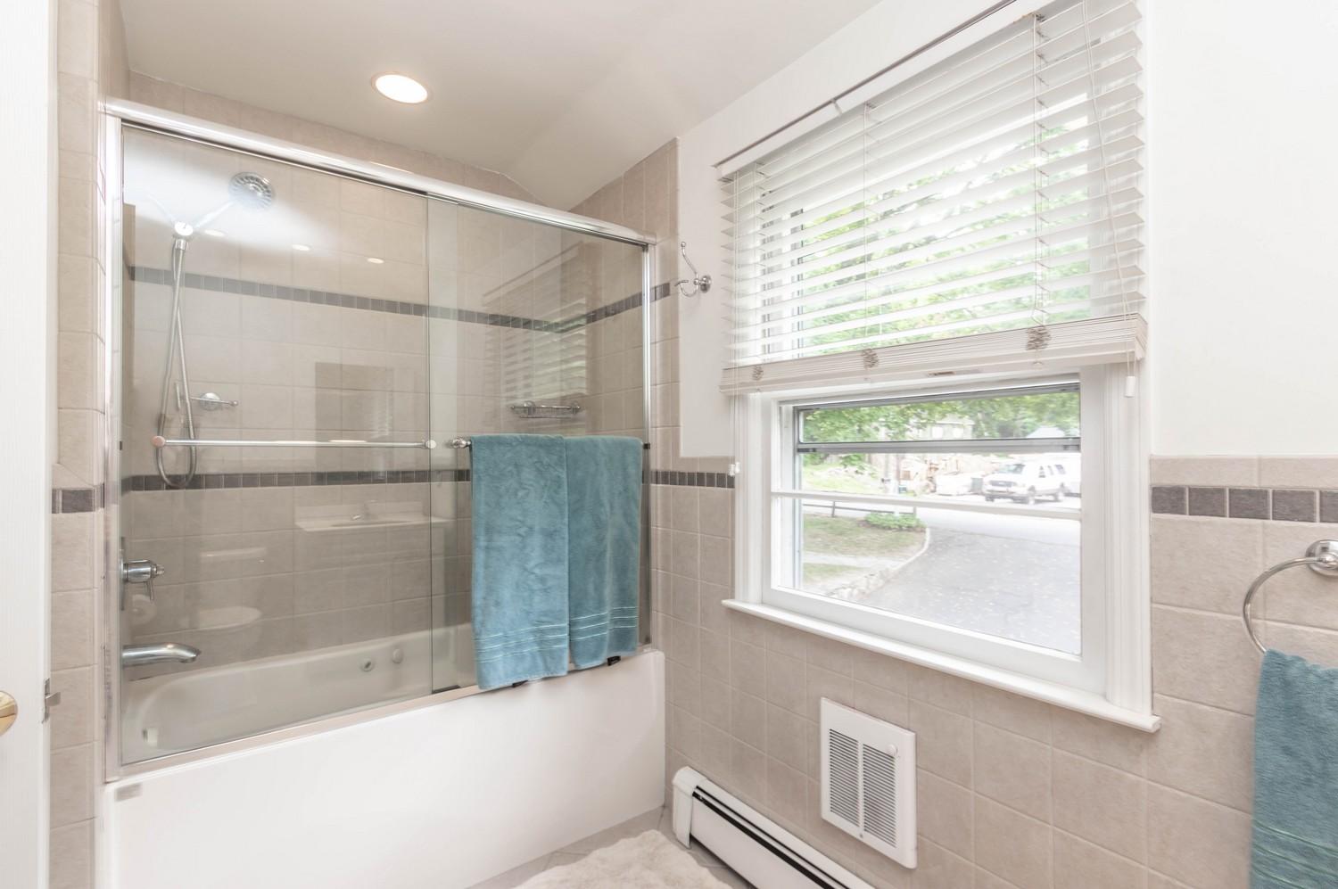 9 Sheffield Road Norwalk, CT 06853 - Photo 29 of 29 a bathroom with a bathtub and a shower