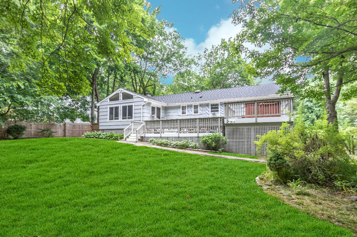 9 Sheffield Road Norwalk, CT 06853 - Photo 3 of 29 a front view of a house with a yard and green space
