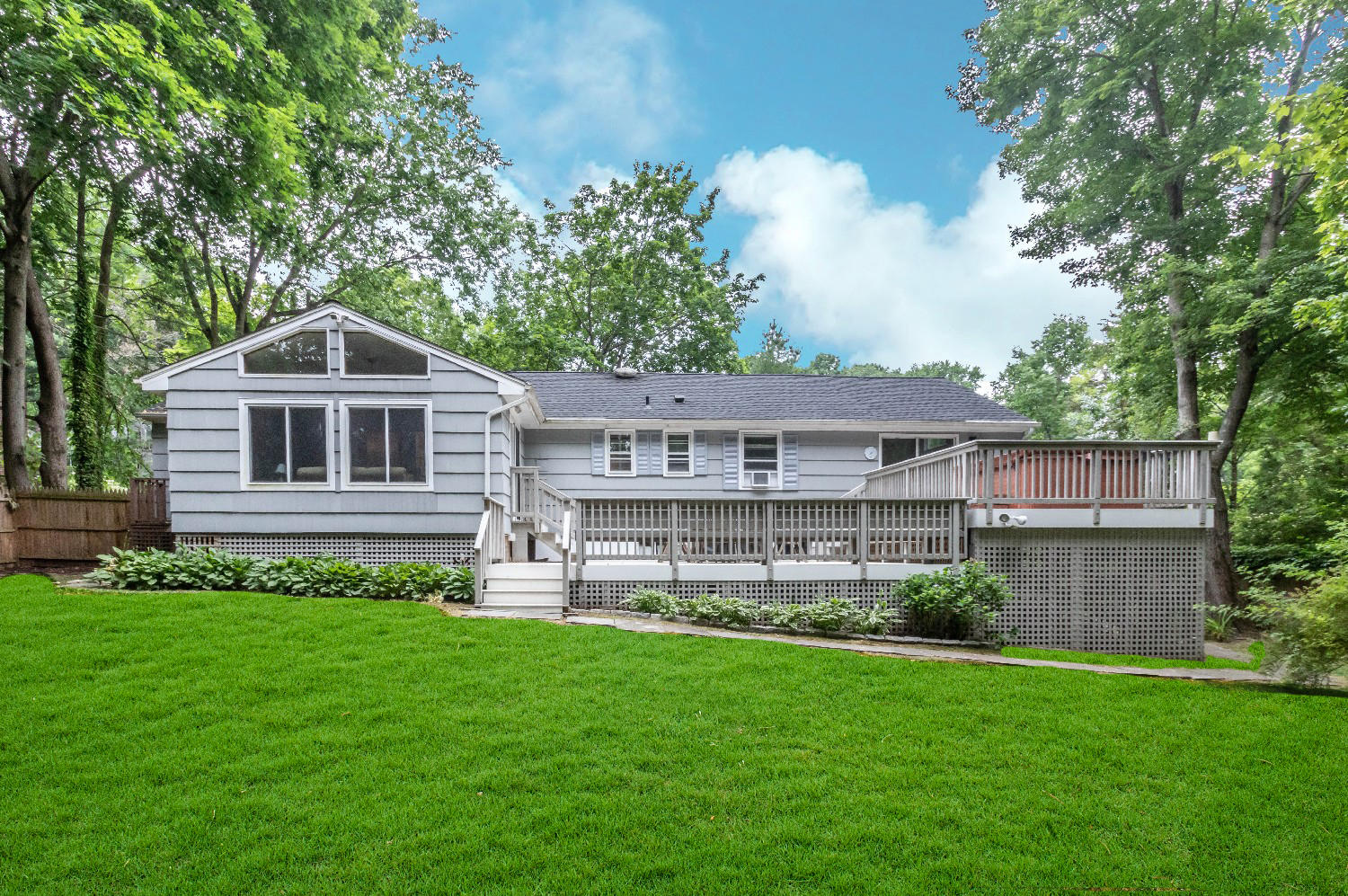 9 Sheffield Road Norwalk, CT 06853 - Photo 4 of 29 a front view of a house with a yard