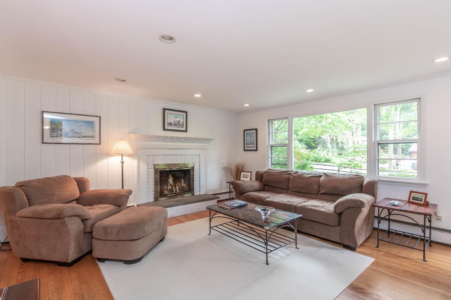 9 Sheffield Road Norwalk, CT 06853 - Photo 9 of 29 a living room with furniture and a fireplace