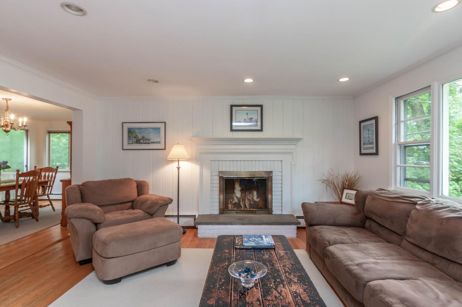9 Sheffield Road Norwalk, CT 06853 - Photo 10 of 29 a living room with furniture and a fireplace