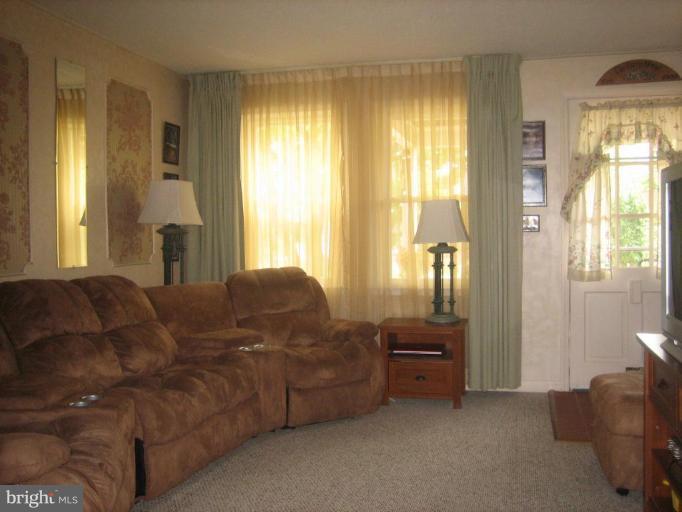 8352 Edgedale Road Parkville, MD 21234 - Photo 2 of 14 a living room with furniture and a large window