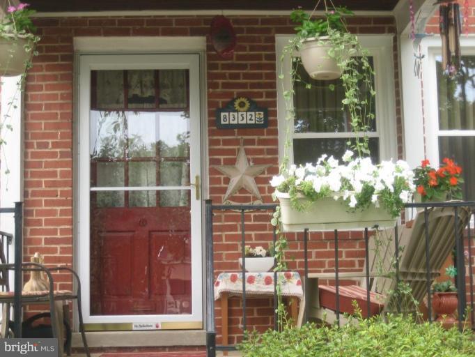 8352 Edgedale Road Parkville, MD 21234 - Photo 14 of 14 a front view of a house with outdoor seating