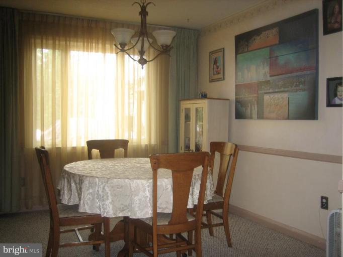8352 Edgedale Road Parkville, MD 21234 - Photo 3 of 14 a view of a dining room with furniture and window