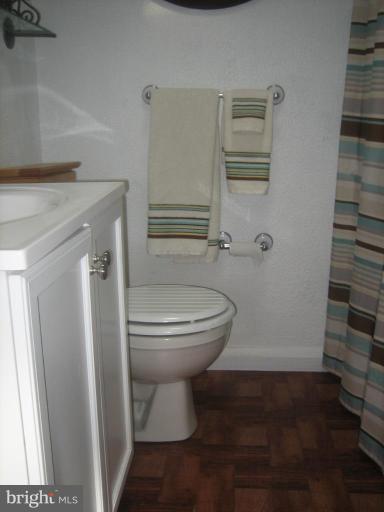 8352 Edgedale Road Parkville, MD 21234 - Photo 7 of 14 a bathroom with a toilet and a shower