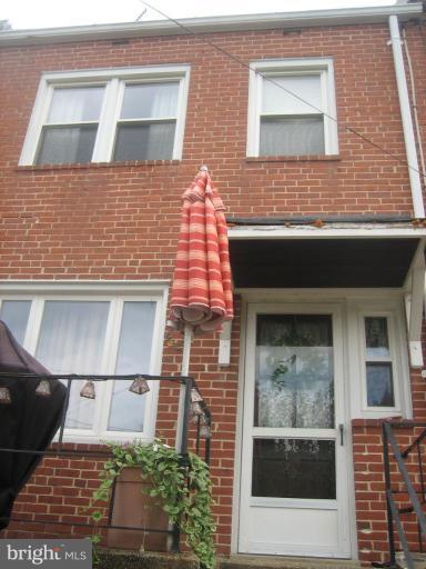 8352 Edgedale Road Parkville, MD 21234 - Photo 10 of 14 a view of a brick house with a window