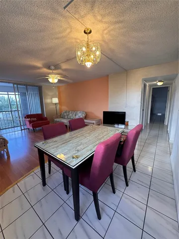 a view of a livingroom with furniture window and wooden floor