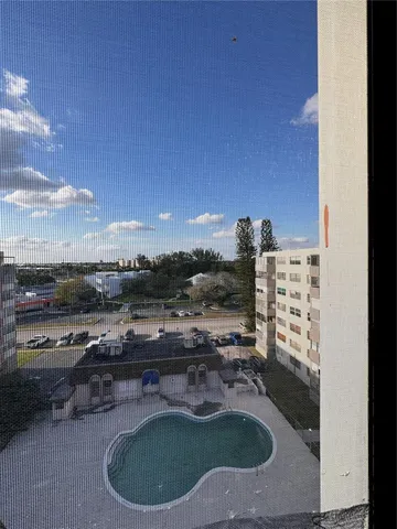 a spacious bedroom with a bed and a table in it