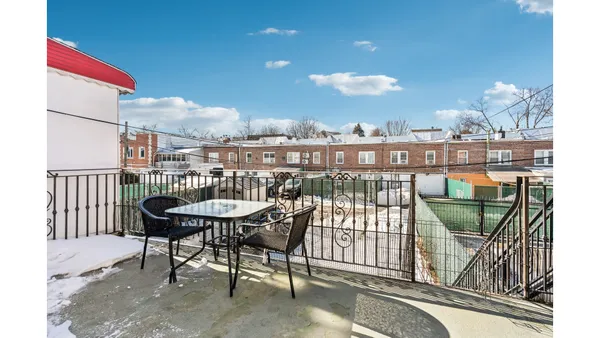 a view of a balcony with chairs