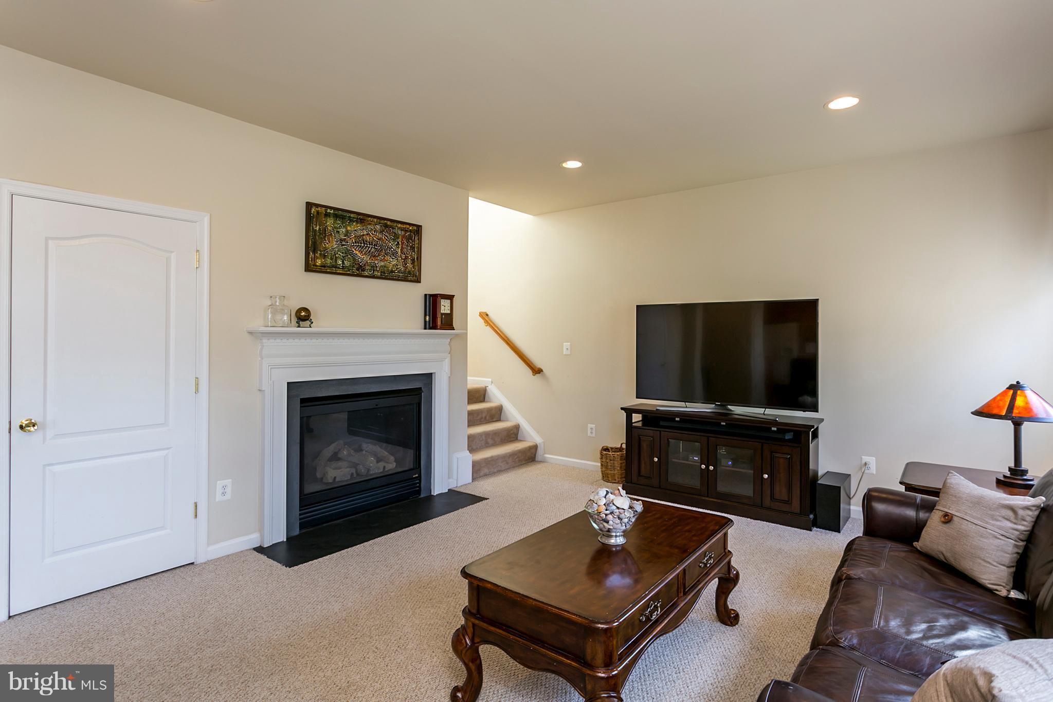 25 Rivers Edge Terrace Indian Head, MD 20640 - Photo 11 of 30 Cozy fireplace as the family room focal point