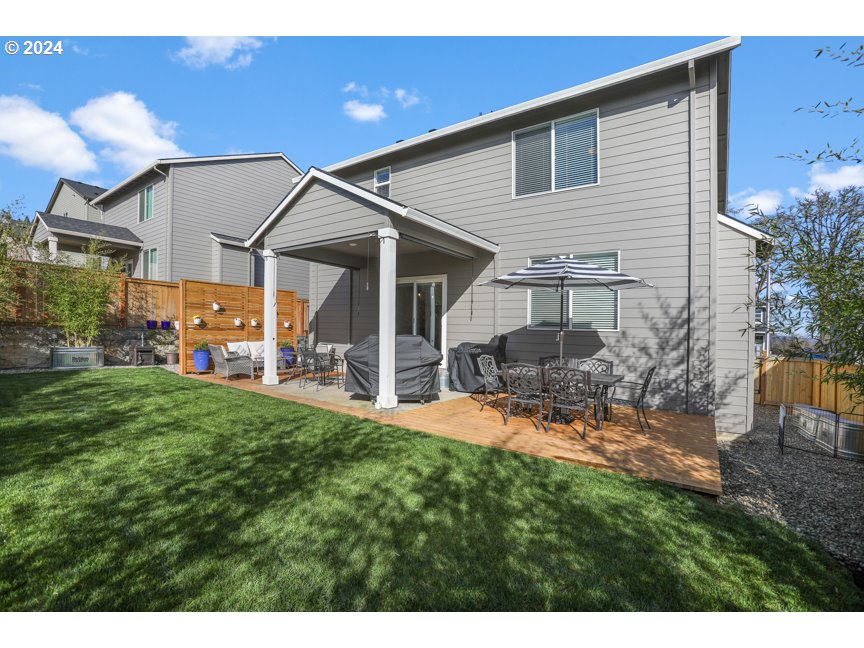 59551 Emerald Loop St. Helens, OR 97051 - Photo 11 of 40 a view of a house with backyard and porch