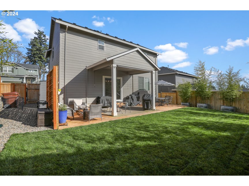 59551 Emerald Loop St. Helens, OR 97051 - Photo 12 of 40 a view of a house with backyard and porch