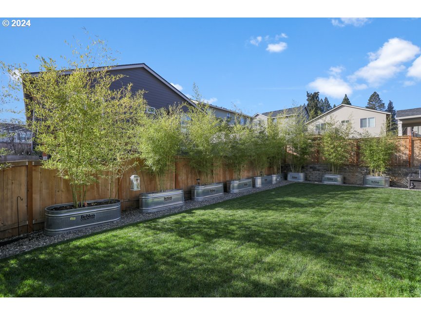 59551 Emerald Loop St. Helens, OR 97051 - Photo 16 of 40 a view of a backyard with a garden