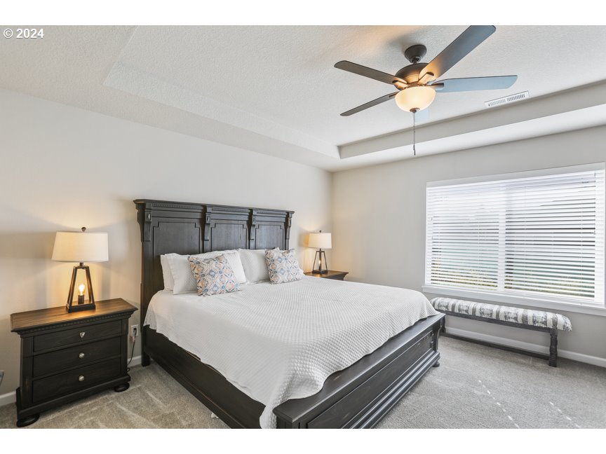 59551 Emerald Loop St. Helens, OR 97051 - Photo 26 of 40 a bedroom with a bed and a window