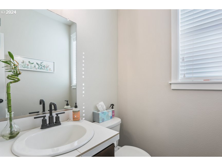 59551 Emerald Loop St. Helens, OR 97051 - Photo 7 of 40 a bathroom with a sink and a mirror