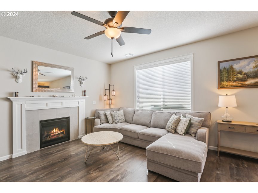 59551 Emerald Loop St. Helens, OR 97051 - Photo 8 of 40 a living room with furniture and a fireplace