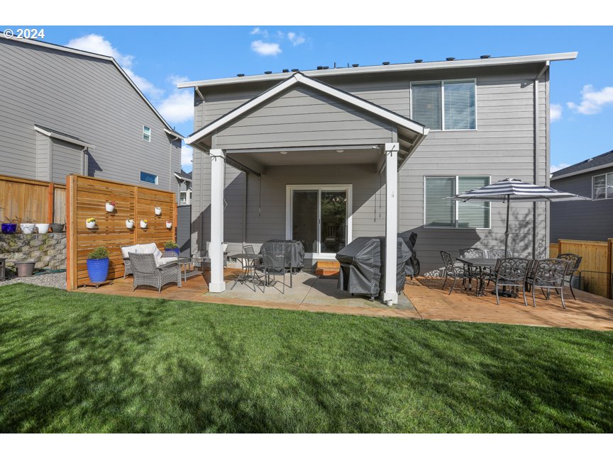 59551 Emerald Loop St. Helens, OR 97051 - Photo 10 of 40 a view of a house with backyard porch and sitting area