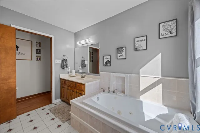 a living room with furniture a window and bookshelf