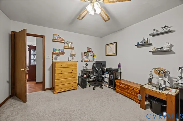 a bathroom with a sink toilet and window