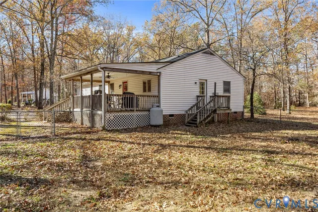 a view of a wooden house with a yard