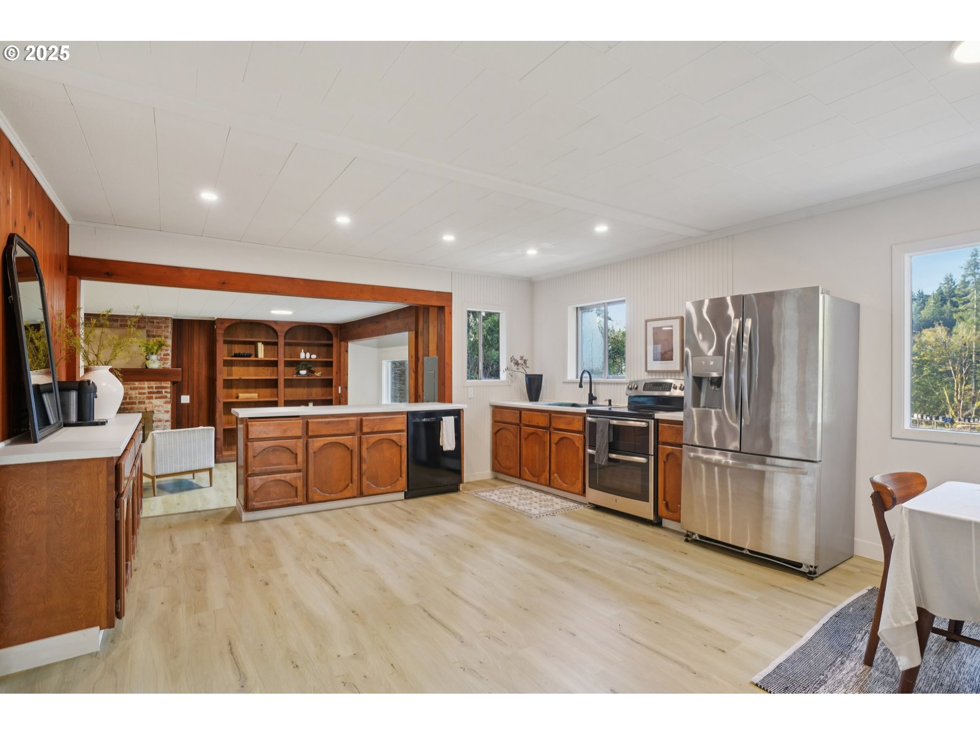 72 Whitewater Road Longview, WA 98632 - Photo 11 of 47 a kitchen with stainless steel appliances kitchen island wooden cabinets and granite counter tops
