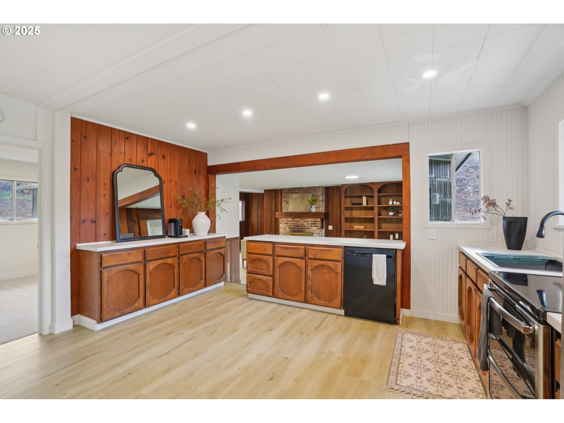 72 Whitewater Road Longview, WA 98632 - Photo 12 of 47 a kitchen with sink a refrigerator and wooden cabinets