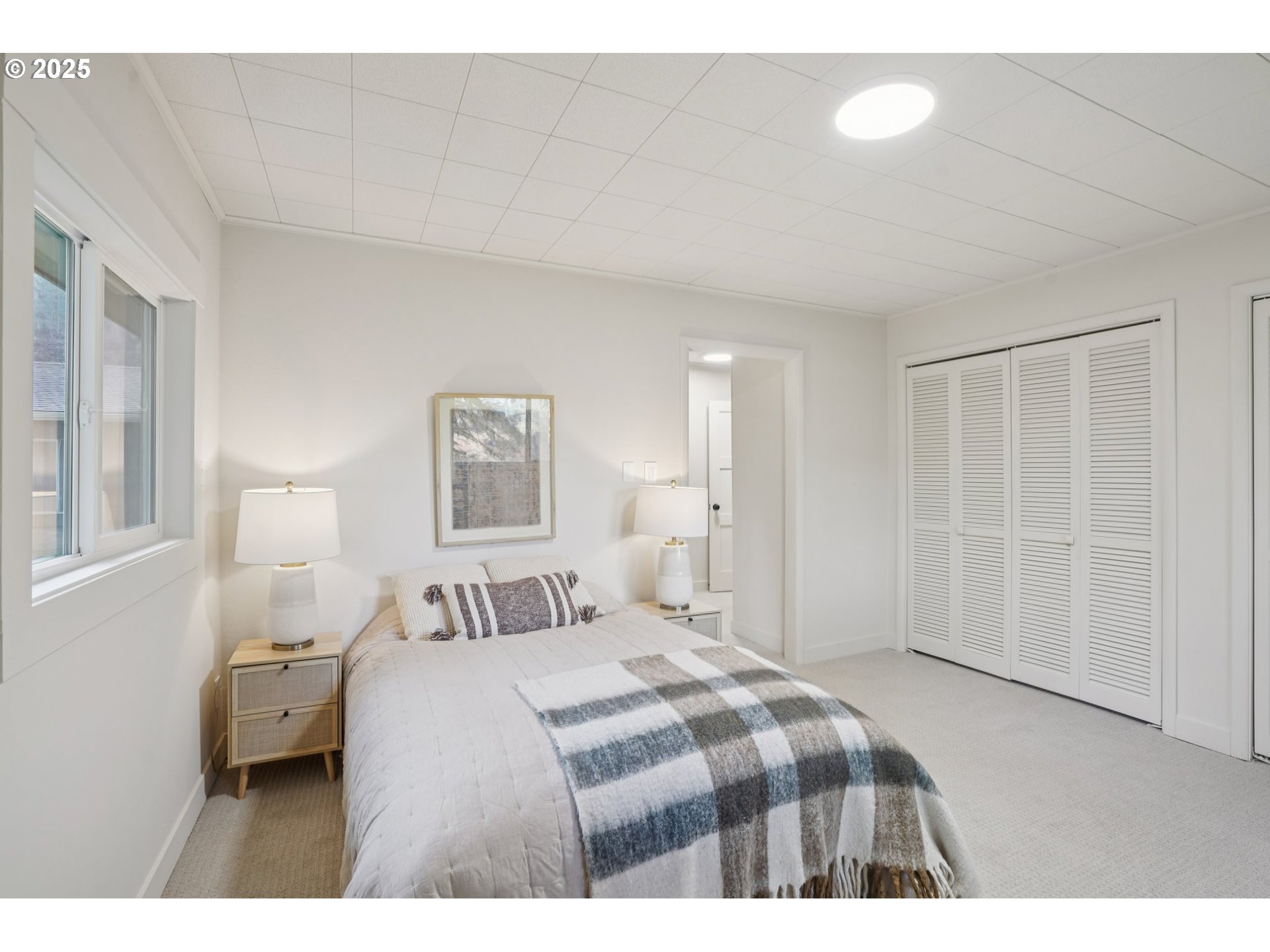 72 Whitewater Road Longview, WA 98632 - Photo 23 of 47 a bedroom with a bed and a painting