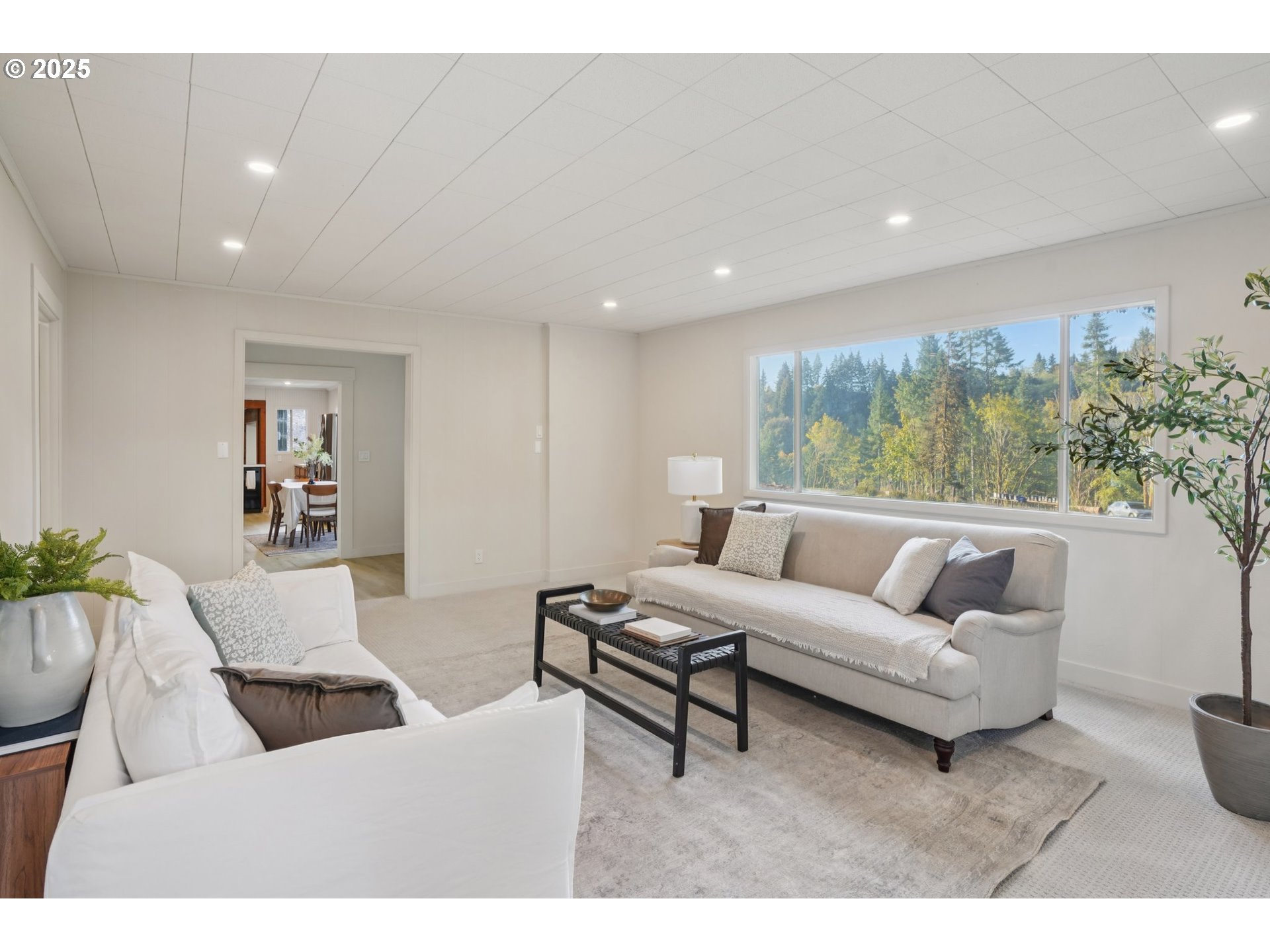 72 Whitewater Road Longview, WA 98632 - Photo 9 of 47 a living room with furniture and a large window