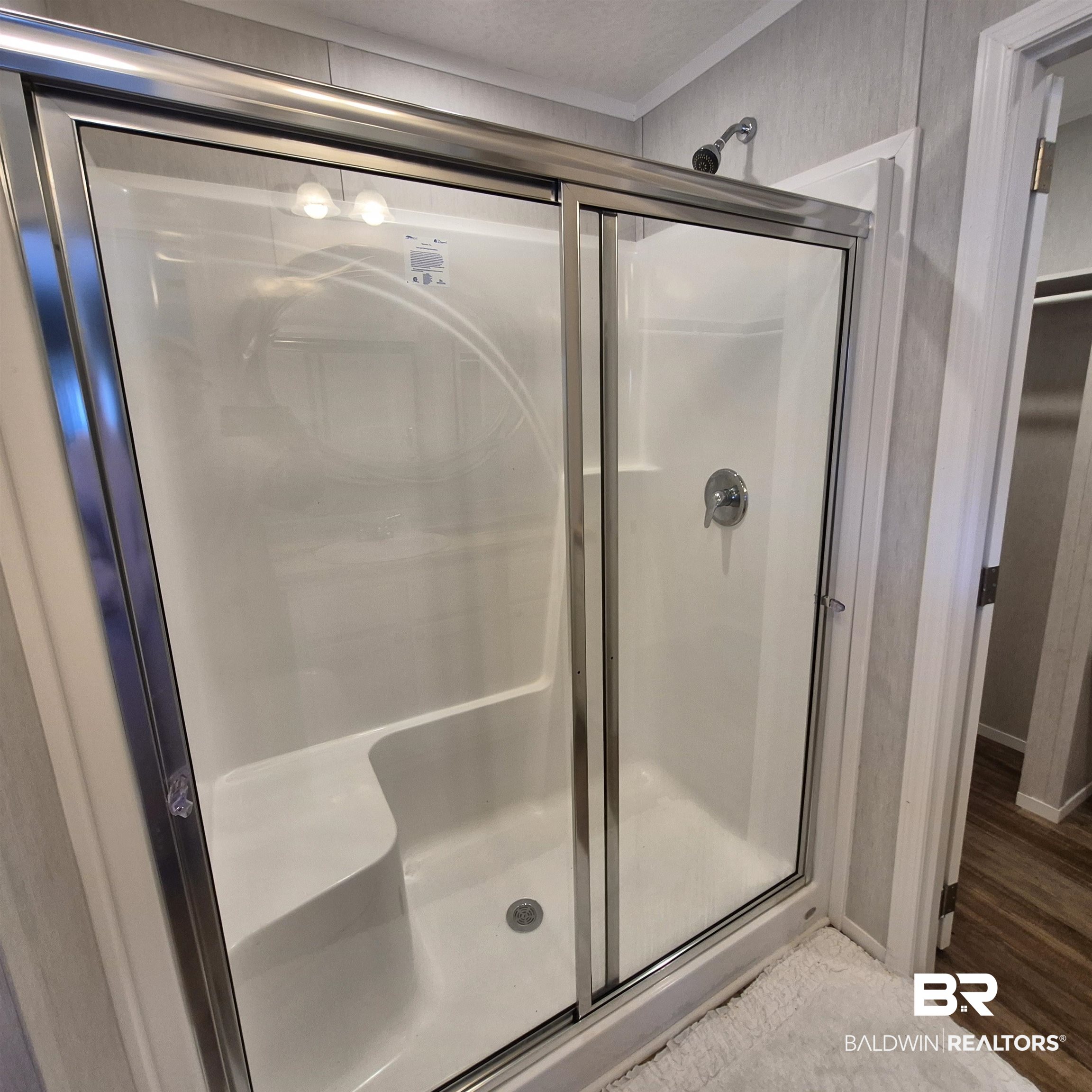 8867 Old Stage Road Repton, AL 36475 - Photo 21 of 37 Bathroom with a shower stall and wood finished floors