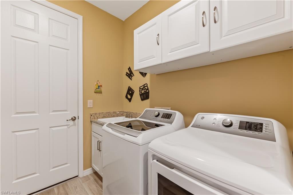 43080 Boardwalk Loop Babcock Ranch, FL 33982 - Photo 20 of 21 a utility room with dryer and washer