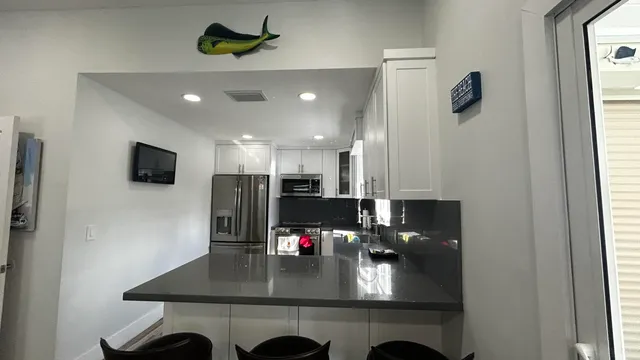 a view of a livingroom with a flat screen tv