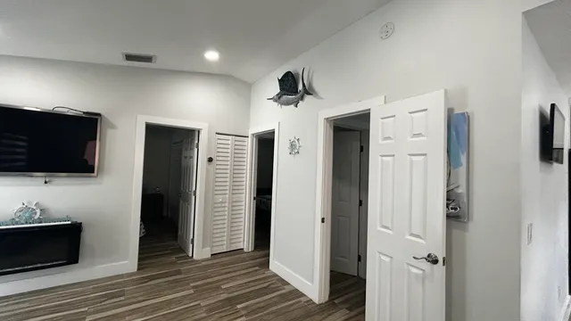 a bathroom with a toilet and a mirror