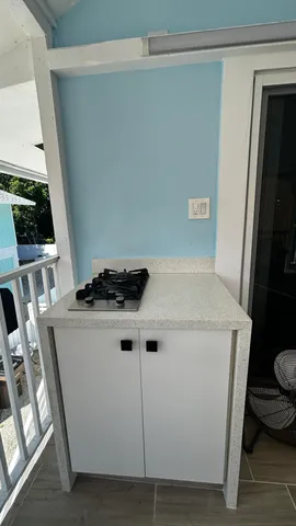 a view of a dining room with furniture and window