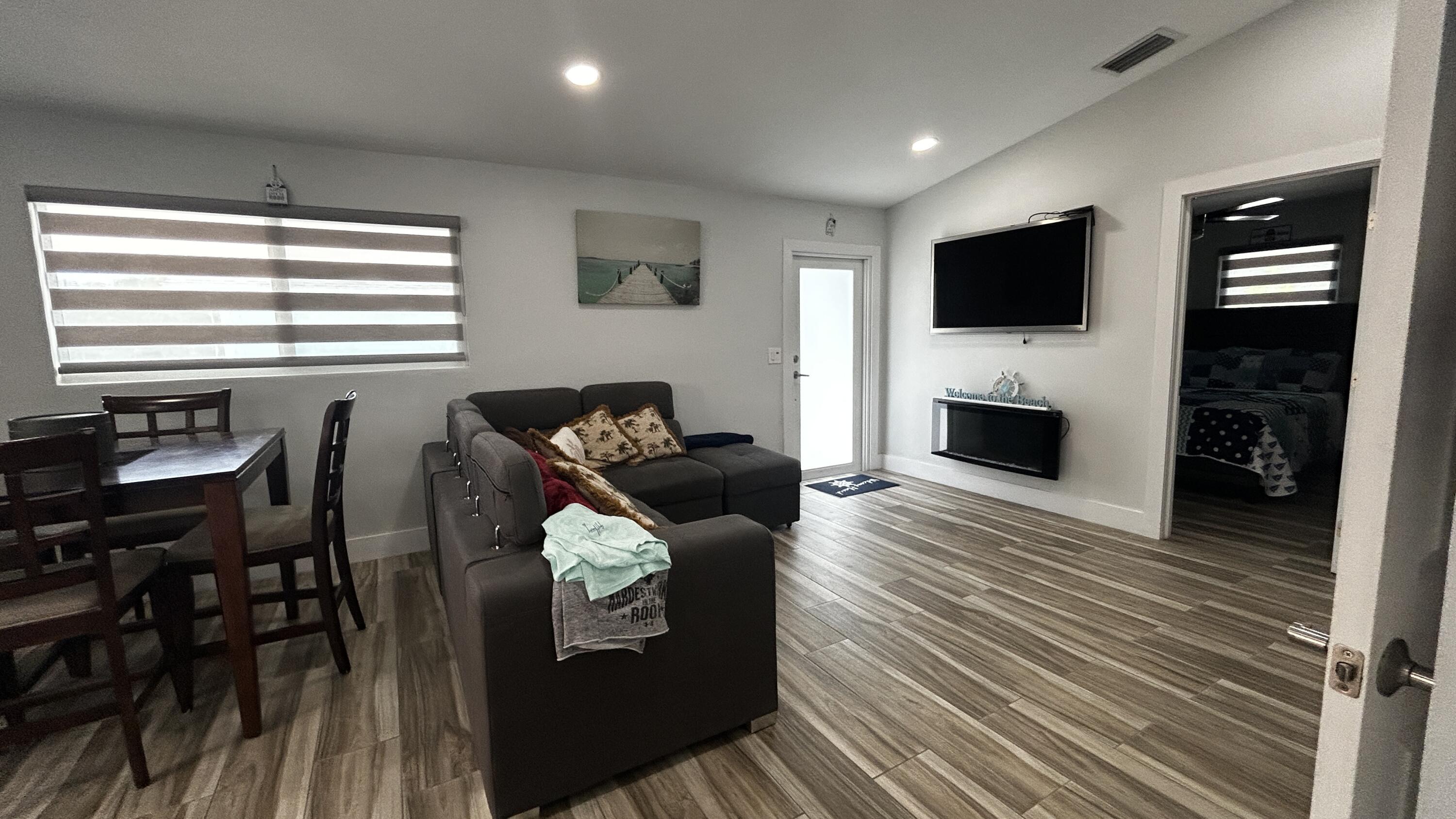 423 Mahogany Avenue Key Largo, FL 33037 - Photo 17 of 37 a living room with furniture and a flat screen tv