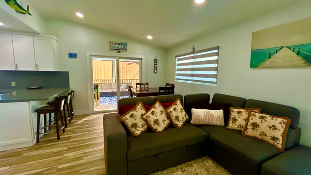 a view of kitchen with furniture and wooden floor